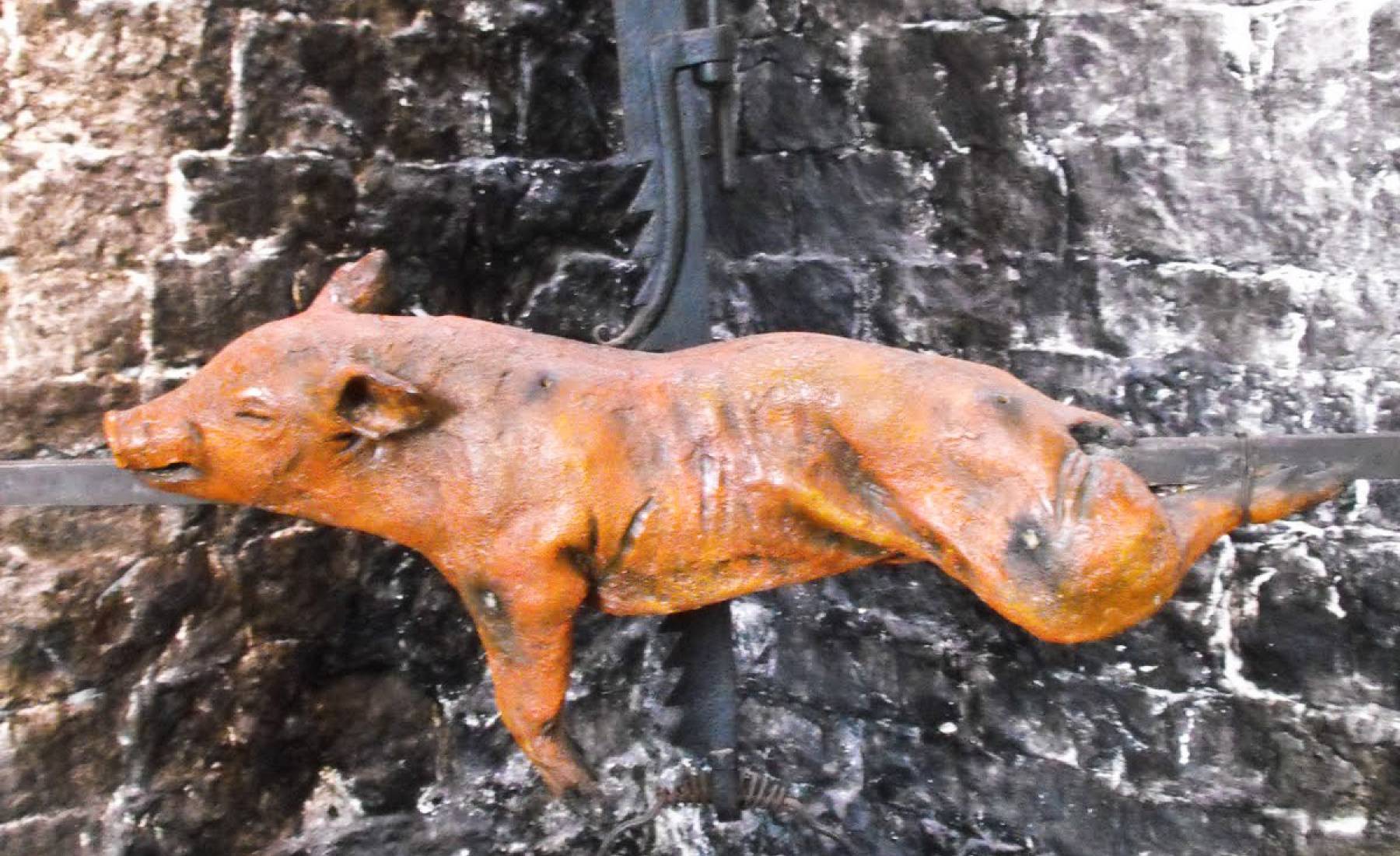 roast pig, glastonbury abbey, medieval kitchen, suckling pig, fake food display, spit roast, crispy